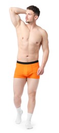 Photo of Young man in stylish orange underwear on white background