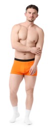 Photo of Young man in stylish orange underwear on white background