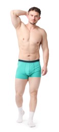 Photo of Young man in stylish turquoise underwear on white background