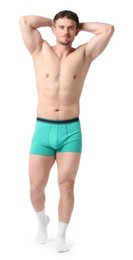 Photo of Young man in stylish turquoise underwear on white background