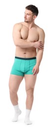 Photo of Young man in stylish turquoise underwear on white background