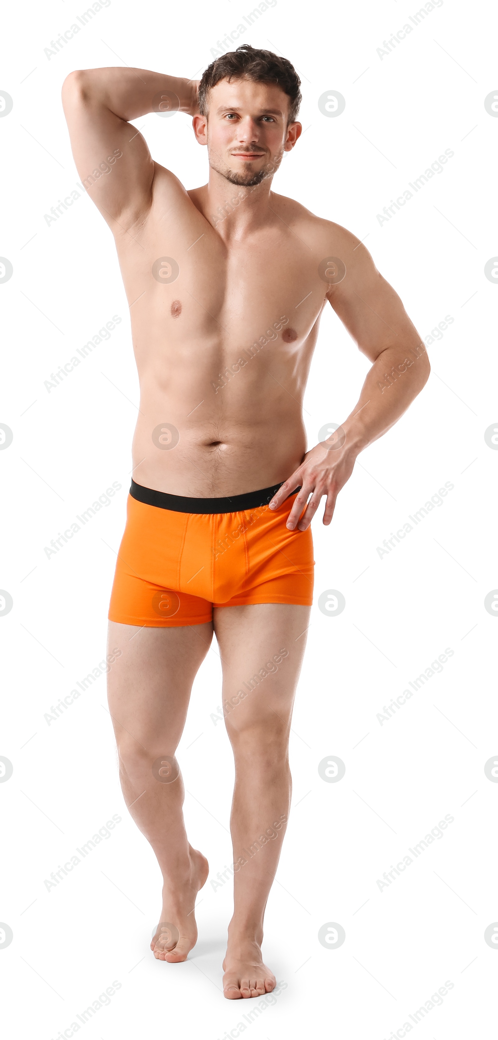 Young man in stylish orange underwear on white background Photo of Young man in stylish orange underwear on white background