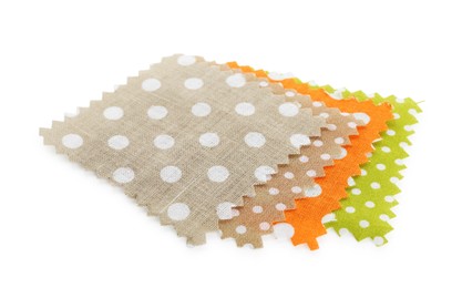 Photo of Samples of fabrics with polka dot pattern isolated on white