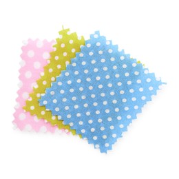 Photo of Samples of fabrics with polka dot pattern isolated on white, top view