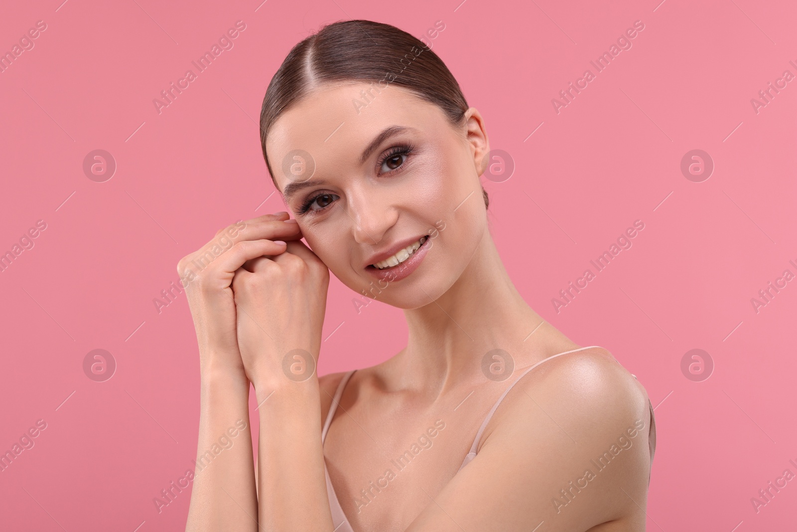 Portrait of beautiful young woman on pink background Photo of Portrait of beautiful young woman on pink background