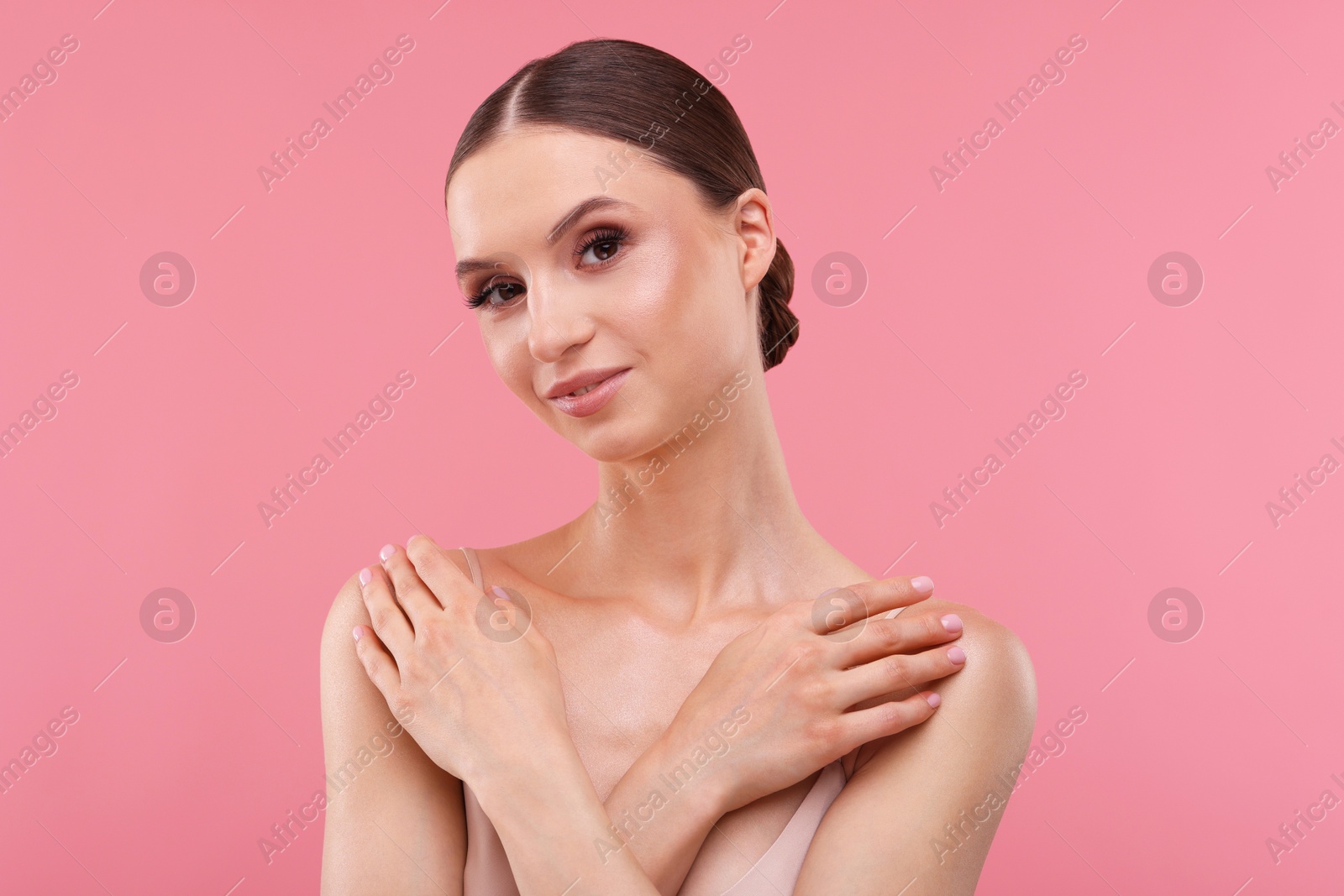 Portrait of beautiful young woman on pink background Photo of Portrait of beautiful young woman on pink background