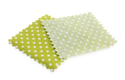 Photo of Samples of fabrics with polka dot pattern isolated on white