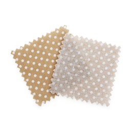 Photo of Samples of fabrics with polka dot pattern isolated on white, top view