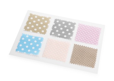 Photo of Samples of fabrics with polka dot pattern isolated on white