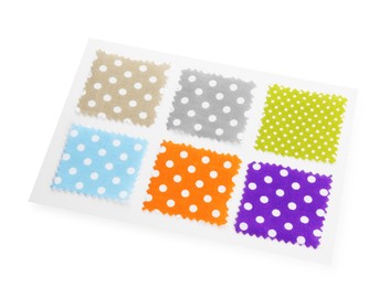 Photo of Samples of fabrics with polka dot pattern isolated on white