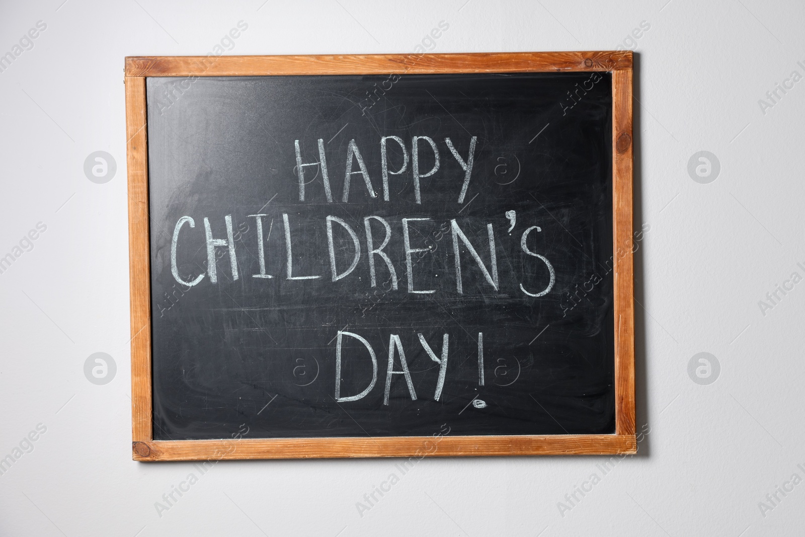 Phrase Happy Children’s Day with exclamation mark on blackboard Photo of Phrase Happy Children’s Day with exclamation mark on blackboard