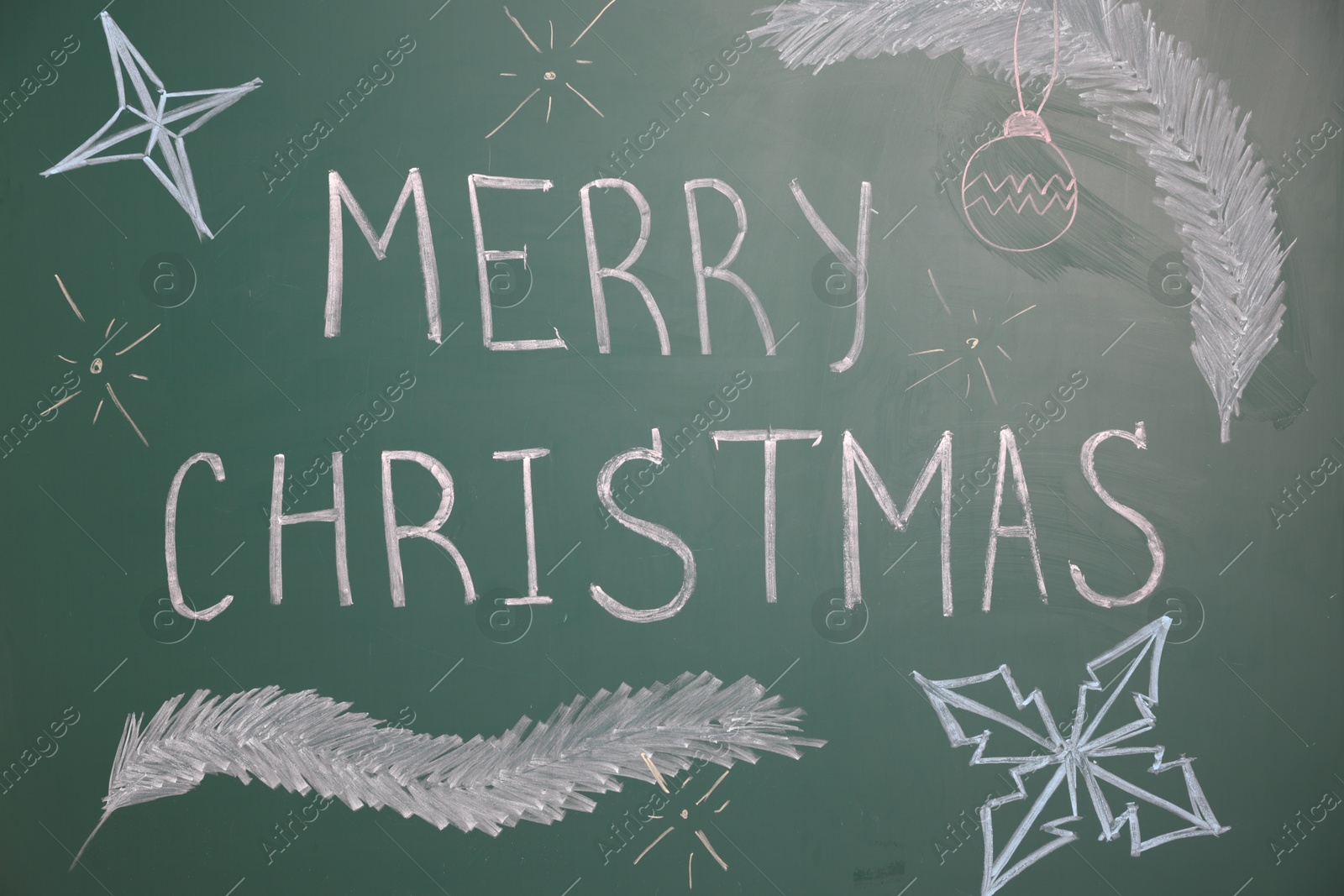 Phrase Merry Christmas and different drawings on green chalkboard Photo of Phrase Merry Christmas and different drawings on green chalkboard