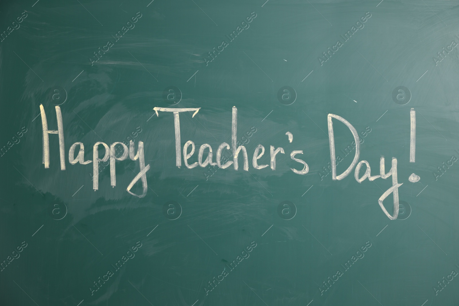 Phrase Happy Teacher’s Day with exclamation mark on green chalkboard, closeup Photo of Phrase Happy Teacher’s Day with exclamation mark on green chalkboard, closeup
