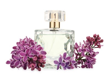 Photo of Bottle of luxury perfume and lilac flowers isolated on white