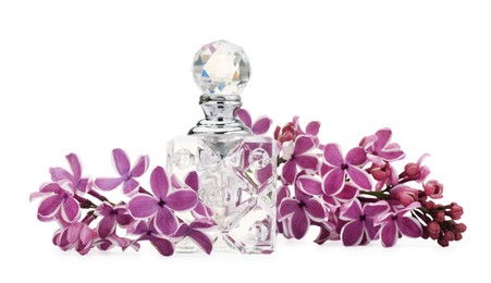 Photo of Bottle of luxury perfume and lilac flowers isolated on white