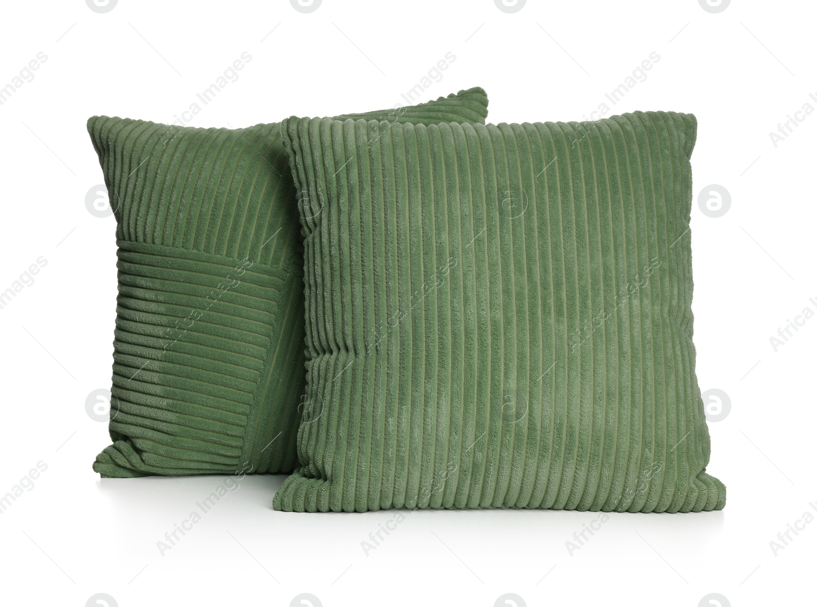 Two stylish green cushions isolated on white Photo of Two stylish green cushions isolated on white