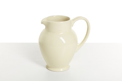 Photo of One elegant ceramic jug isolated on white