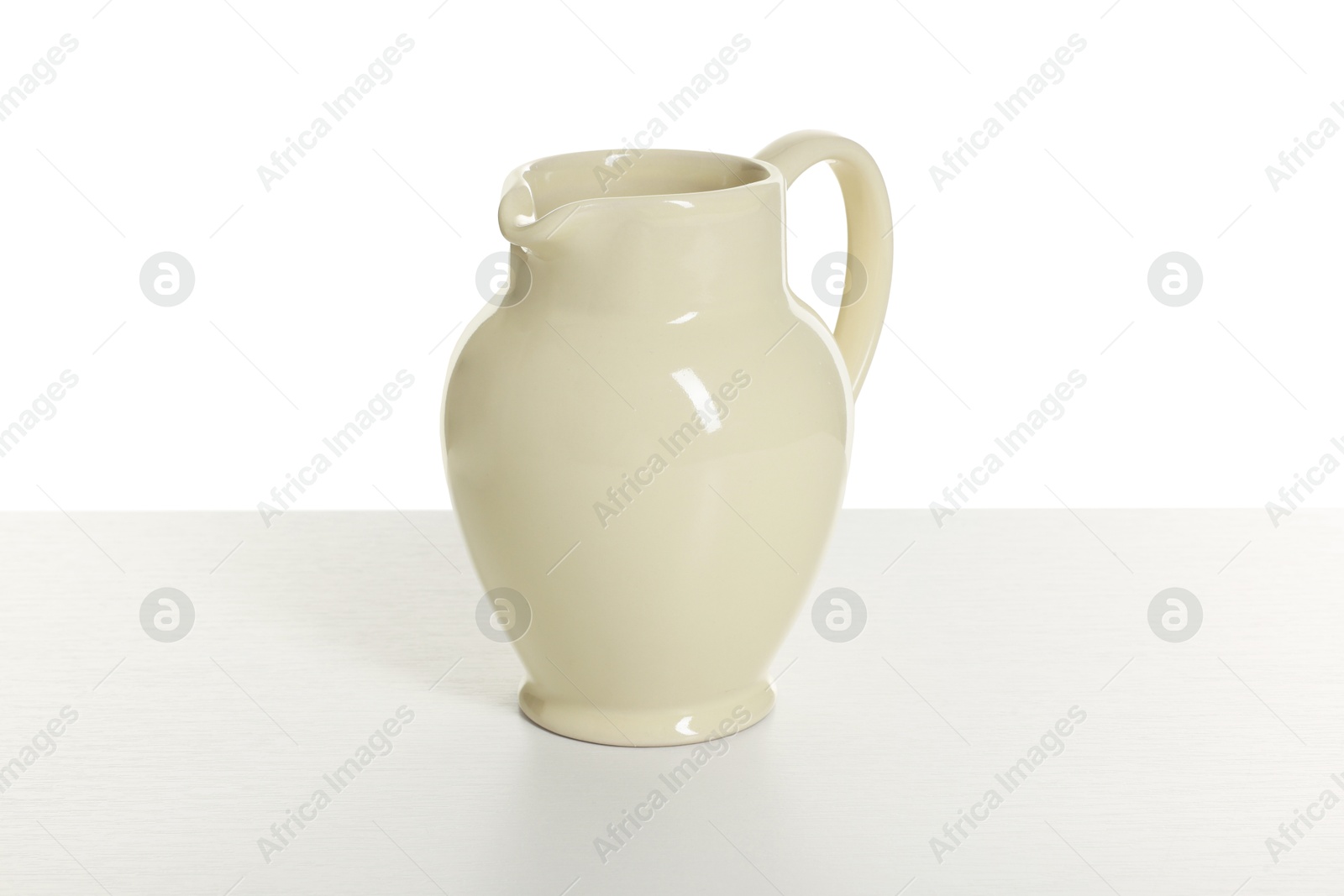One elegant ceramic jug isolated on white Photo of One elegant ceramic jug isolated on white