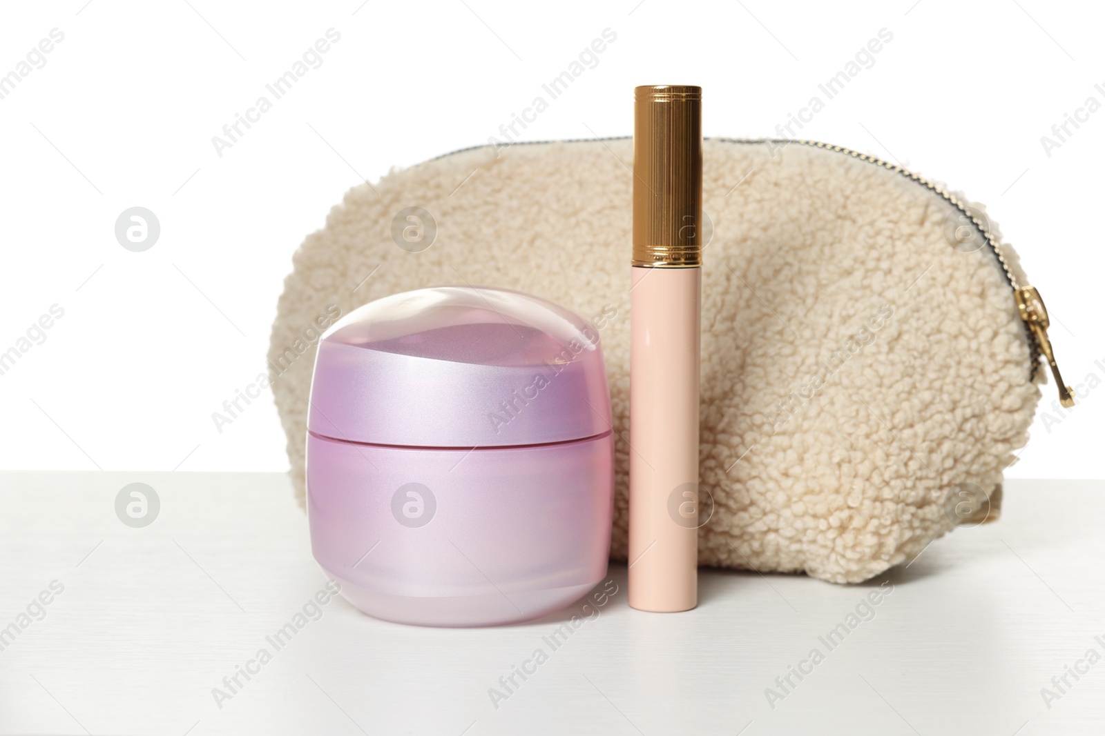 Cosmetic products and bag isolated on white Photo of Cosmetic products and bag isolated on white