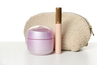 Photo of Cosmetic products and bag isolated on white