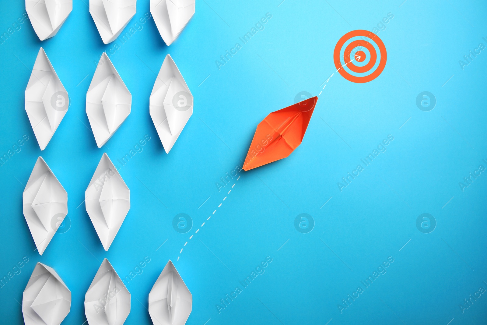 Targeting. Orange paper boat among white ones heading to bullseye on light blue background, top view Image of Targeting. Orange paper boat among white ones heading to bullseye on light blue background, top view