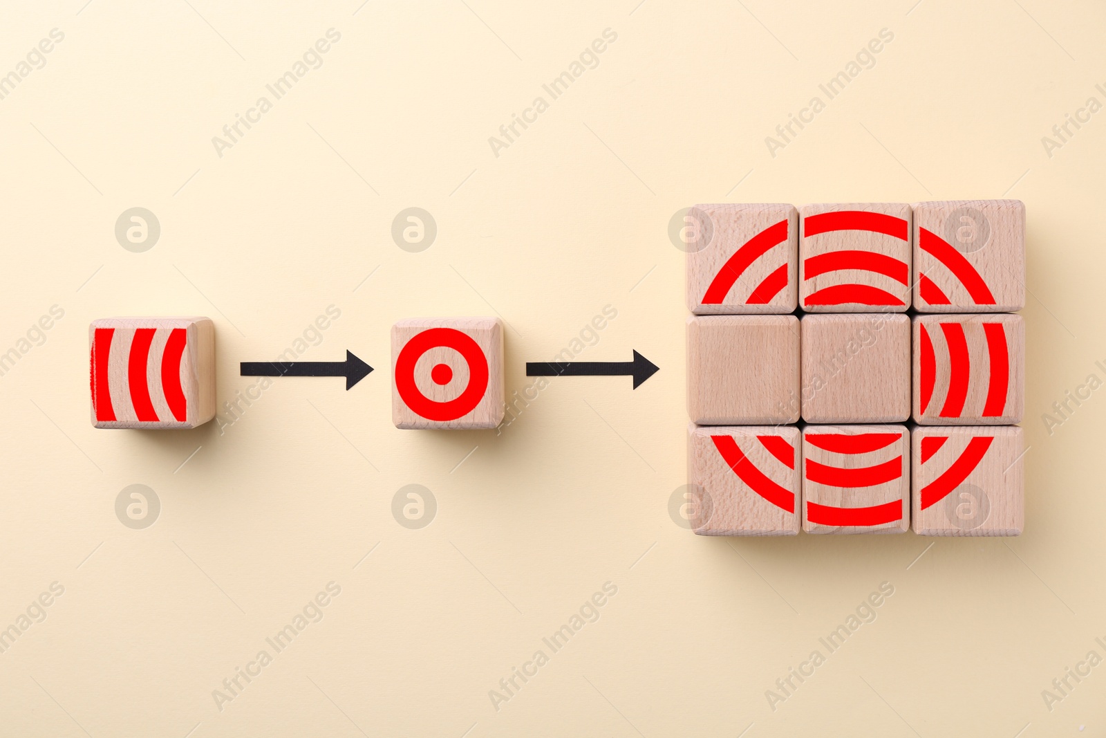 Targeting. Empty wooden cubes must be replaced by others one with elements to make image of bullseye on beige background, top view Image of Targeting. Empty wooden cubes must be replaced by others one with elements to make image of bullseye on beige background, top view