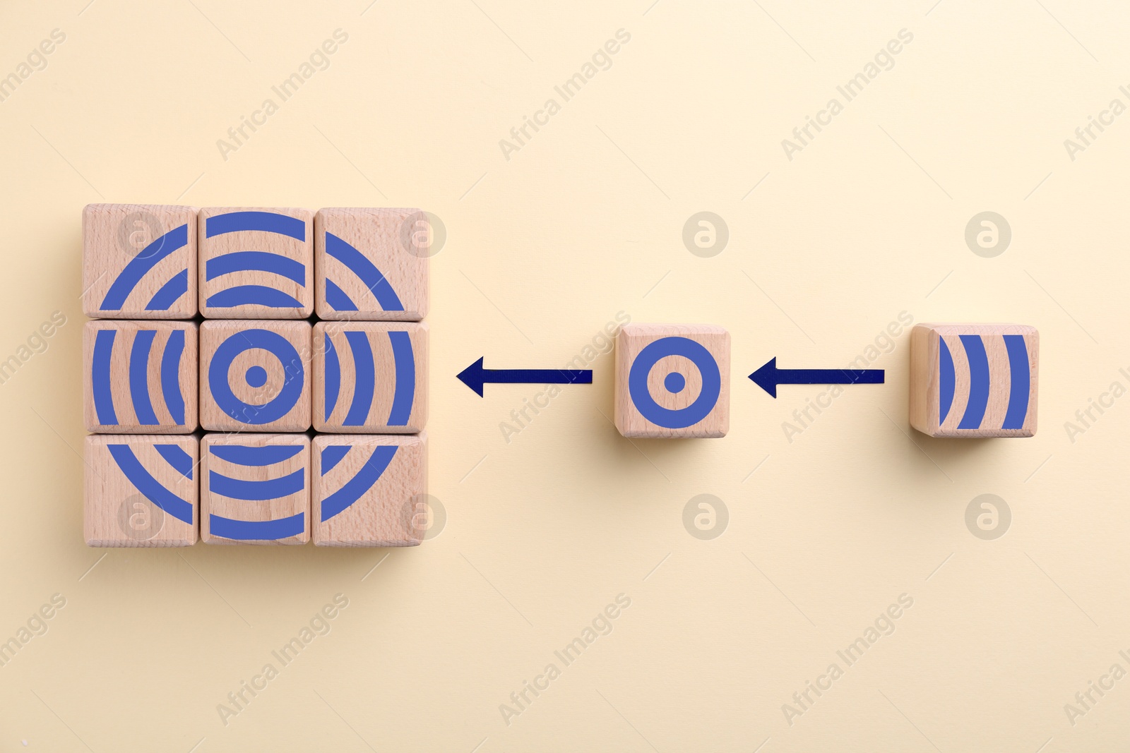 Targeting. Bullseye image made of wooden cubes on beige background, top view. Cubes with elements as parts of whole Image of Targeting. Bullseye image made of wooden cubes on beige background, top view. Cubes with elements as parts of whole