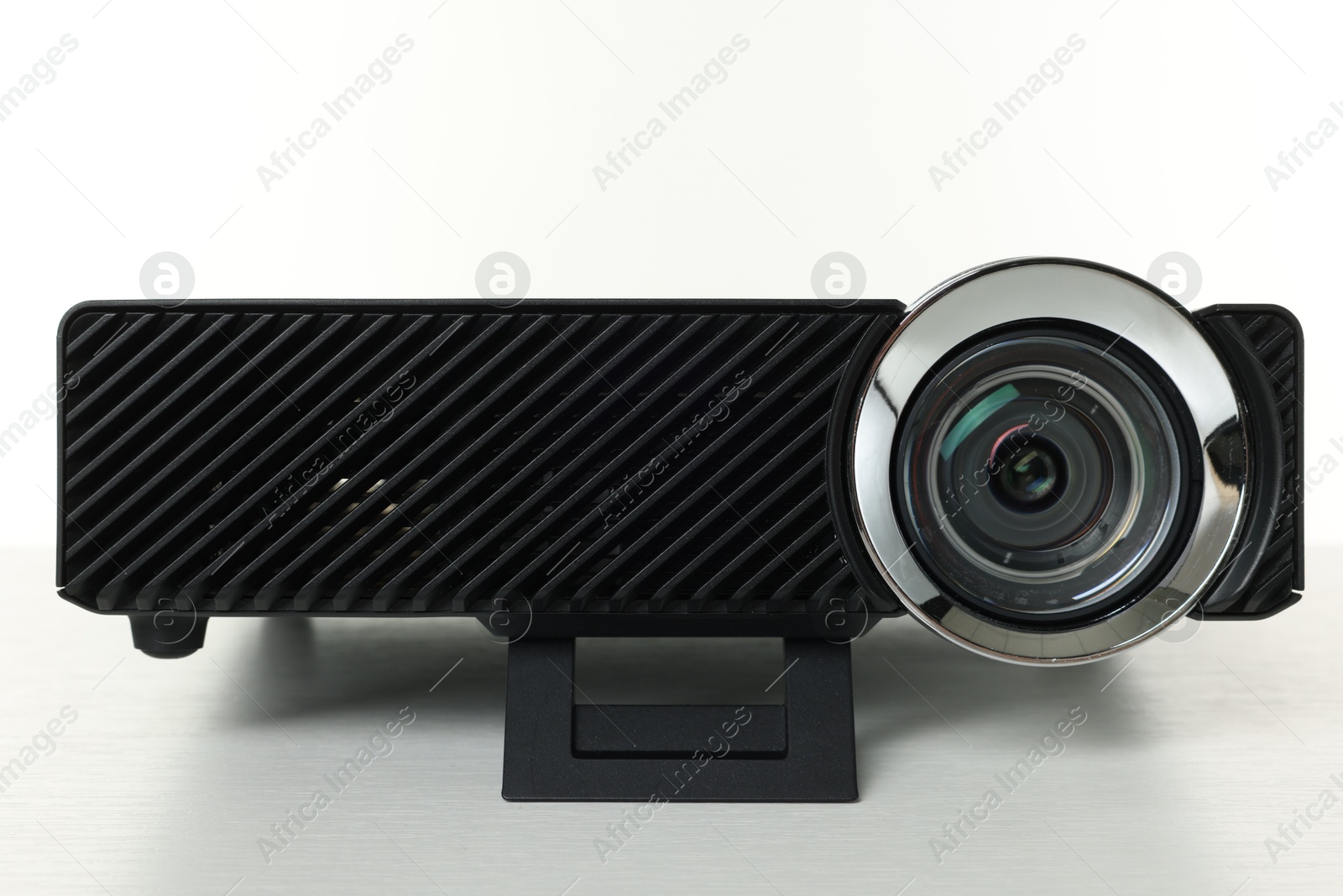 Photo of One modern video projector isolated on white