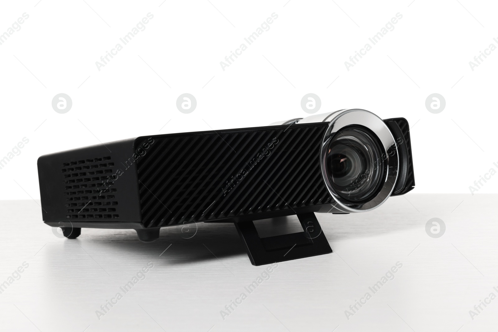 One modern video projector isolated on white Photo of One modern video projector isolated on white