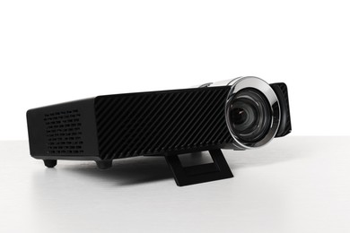 Photo of One modern video projector isolated on white