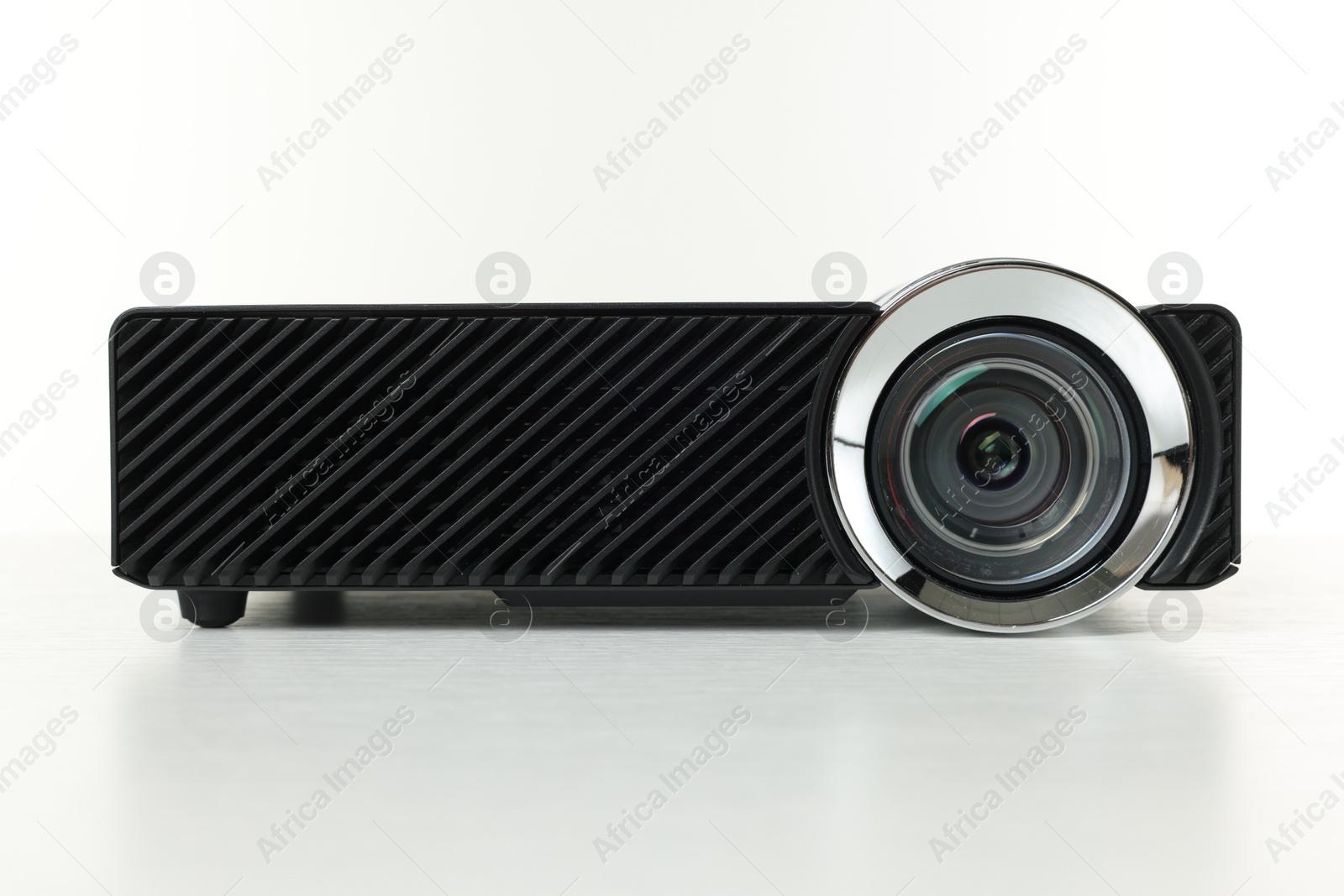 Photo of One modern video projector isolated on white