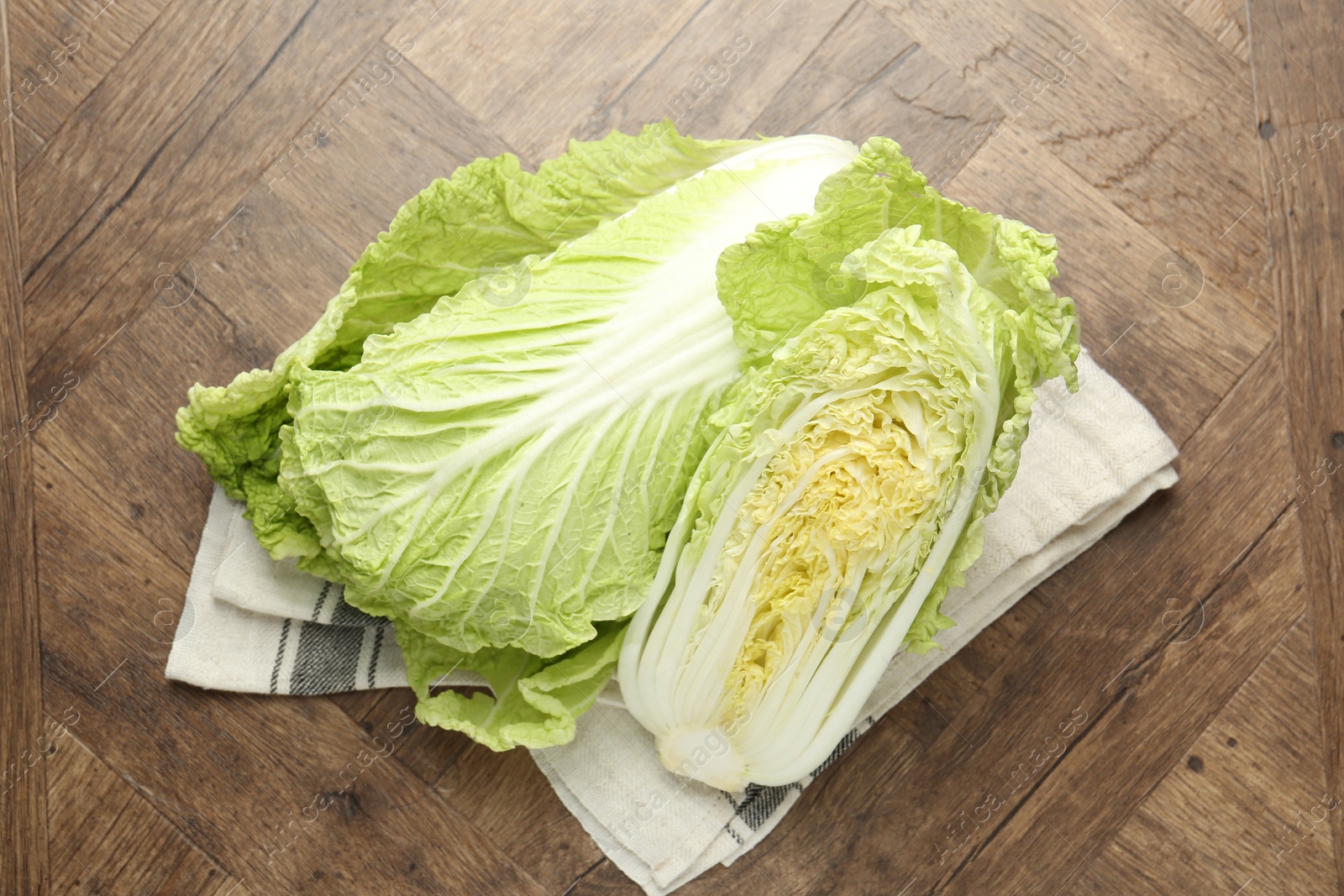 Fresh Chinese cabbages on wooden table, top view Photo of Fresh Chinese cabbages on wooden table, top view