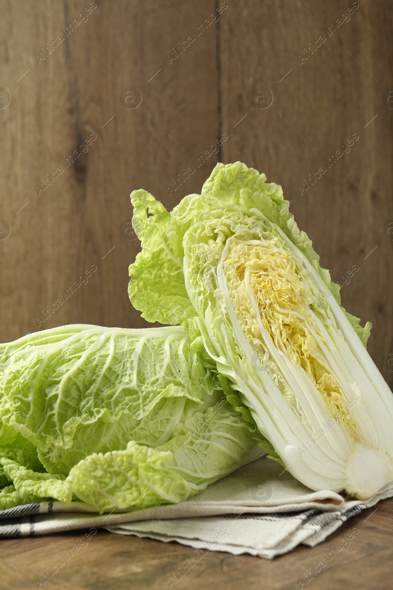 Fresh Chinese cabbages on wooden table, closeup Photo of Fresh Chinese cabbages on wooden table, closeup