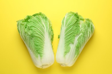 Photo of Fresh Chinese cabbages on yellow background, top view