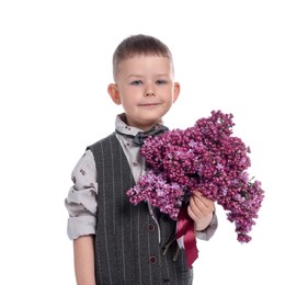 Photo of Little boy with bouquet of lilac flowers on white background
