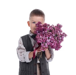 Photo of Little boy with bouquet of lilac flowers on white background