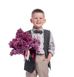 Photo of Little boy with bouquet of lilac flowers on white background