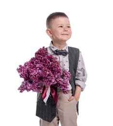 Photo of Little boy with bouquet of lilac flowers on white background