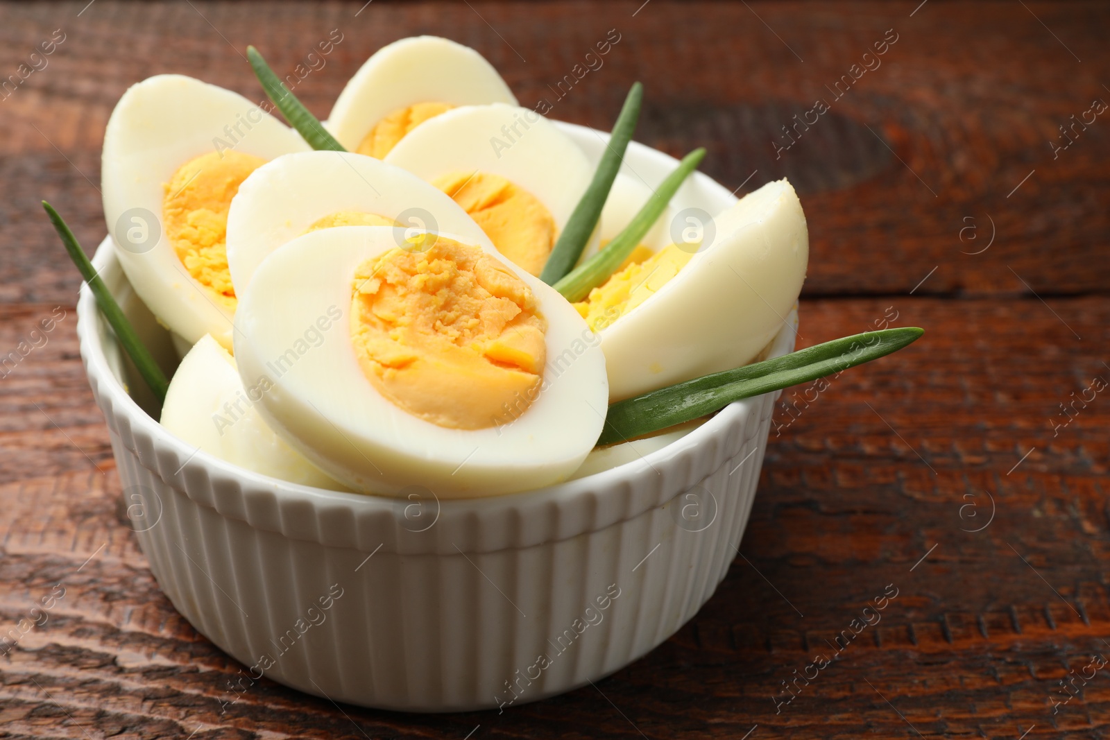 Boiled eggs and green onions on wooden table, closeup. Space for text Photo of Boiled eggs and green onions on wooden table, closeup. Space for text