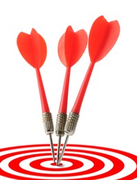 Image of Targeting. Three darts in center of bullseye on white background