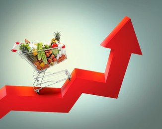 Image of Shopping cart with different groceries on upward red arrow against grey gradient background. Rising cost for food basket. Consumer Price Index