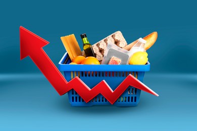 Image of Shopping basket with different groceries and upward red arrow against blue background. Rising cost for food basket. Consumer Price Index