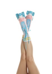 Photo of Woman in roller skates on white background, closeup