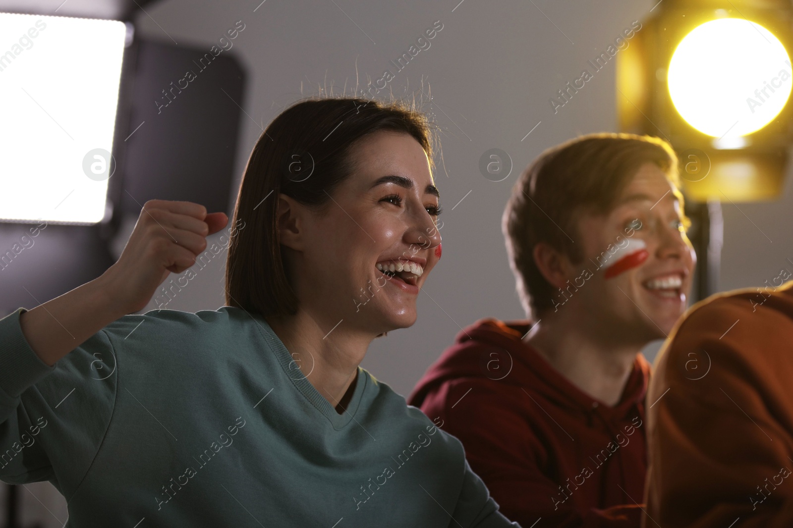 Emotional sports fans watching game together indoors Photo of Emotional sports fans watching game together indoors