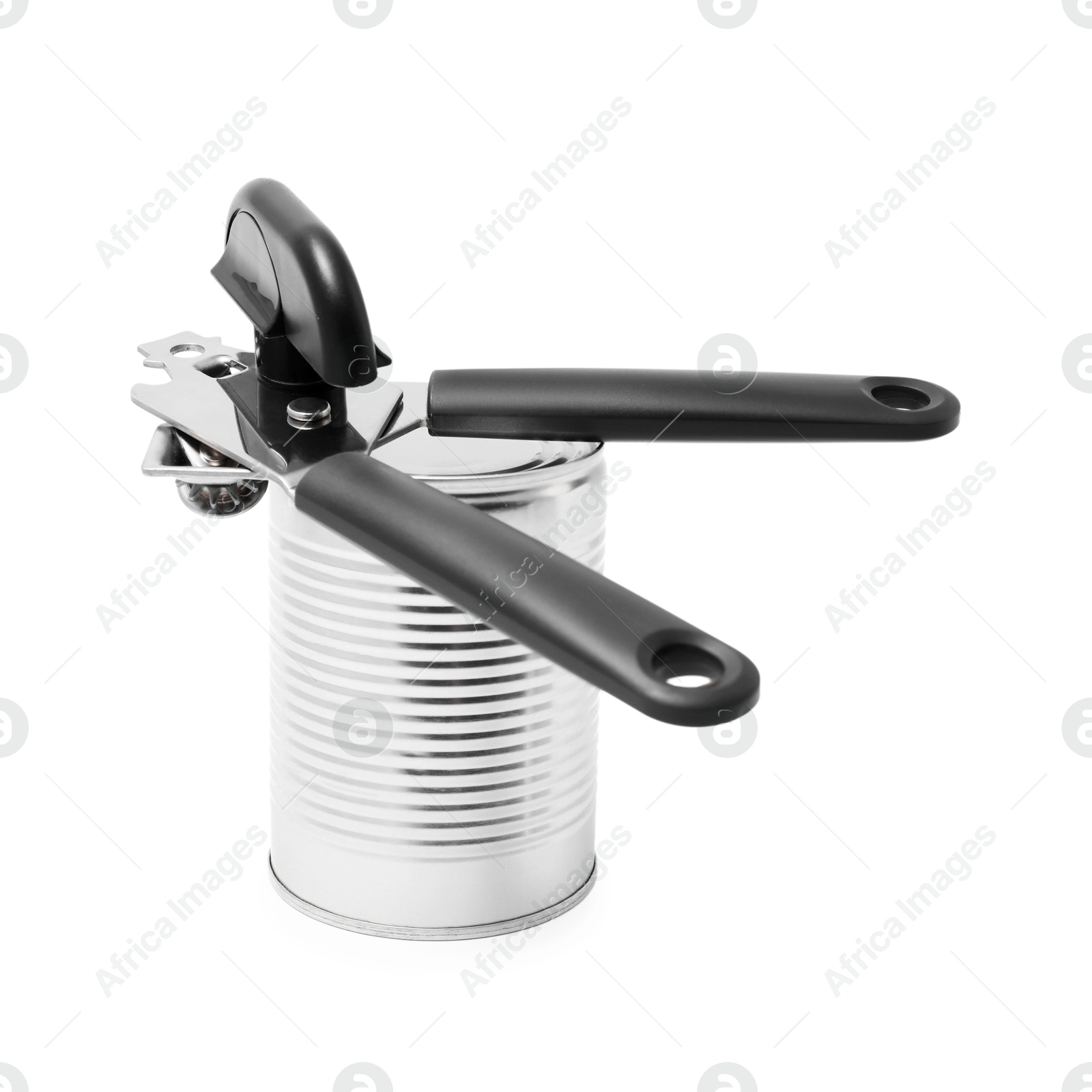Can opener and tin isolated on white Photo of Can opener and tin isolated on white