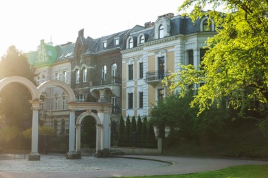 Photo of View of beautiful park near residential building outdoors