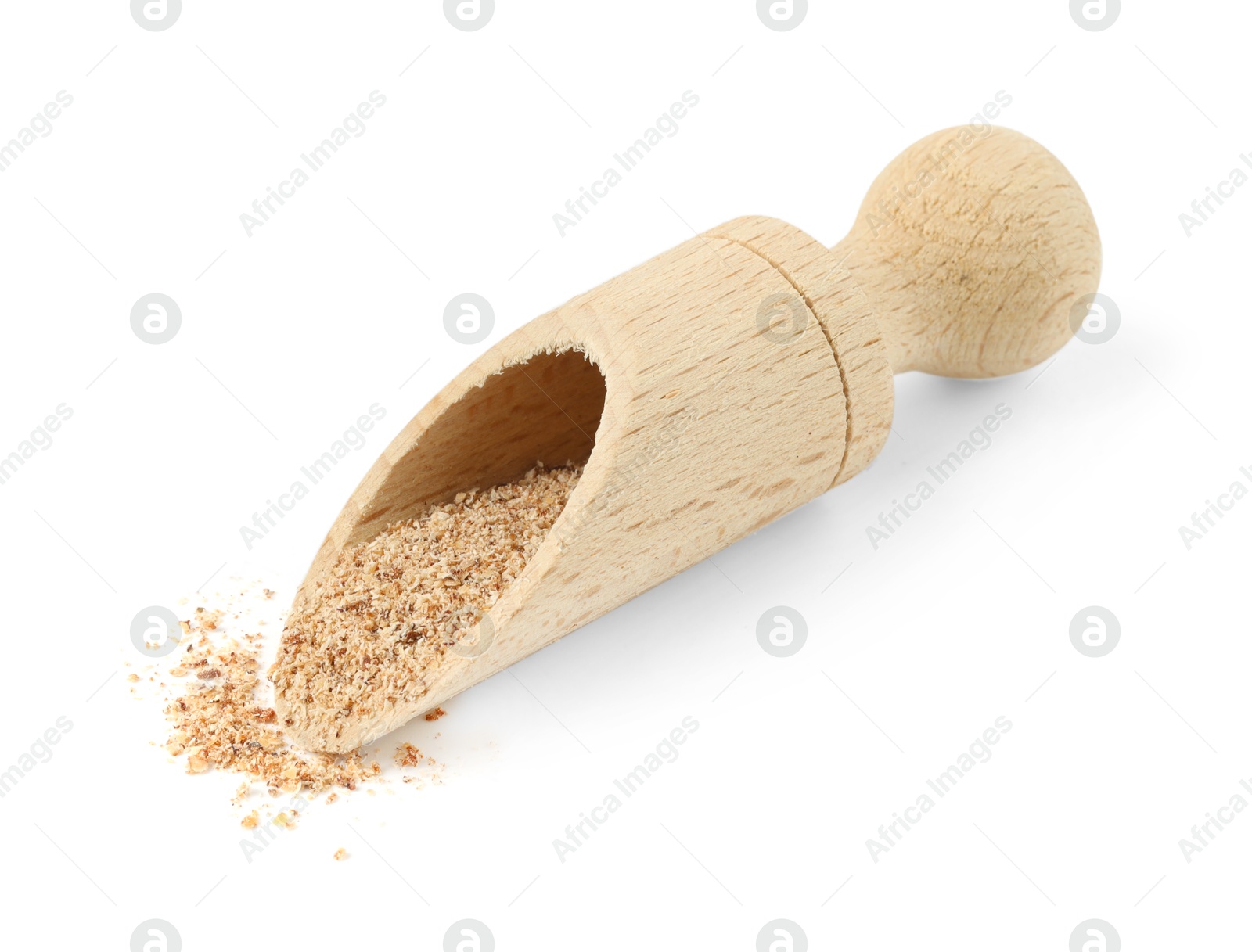 Nutmeg powder in scoop isolated on white Photo of Nutmeg powder in scoop isolated on white