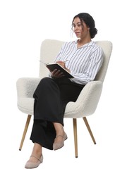 Photo of Professional psychologist with notebook and pen in armchair on white background