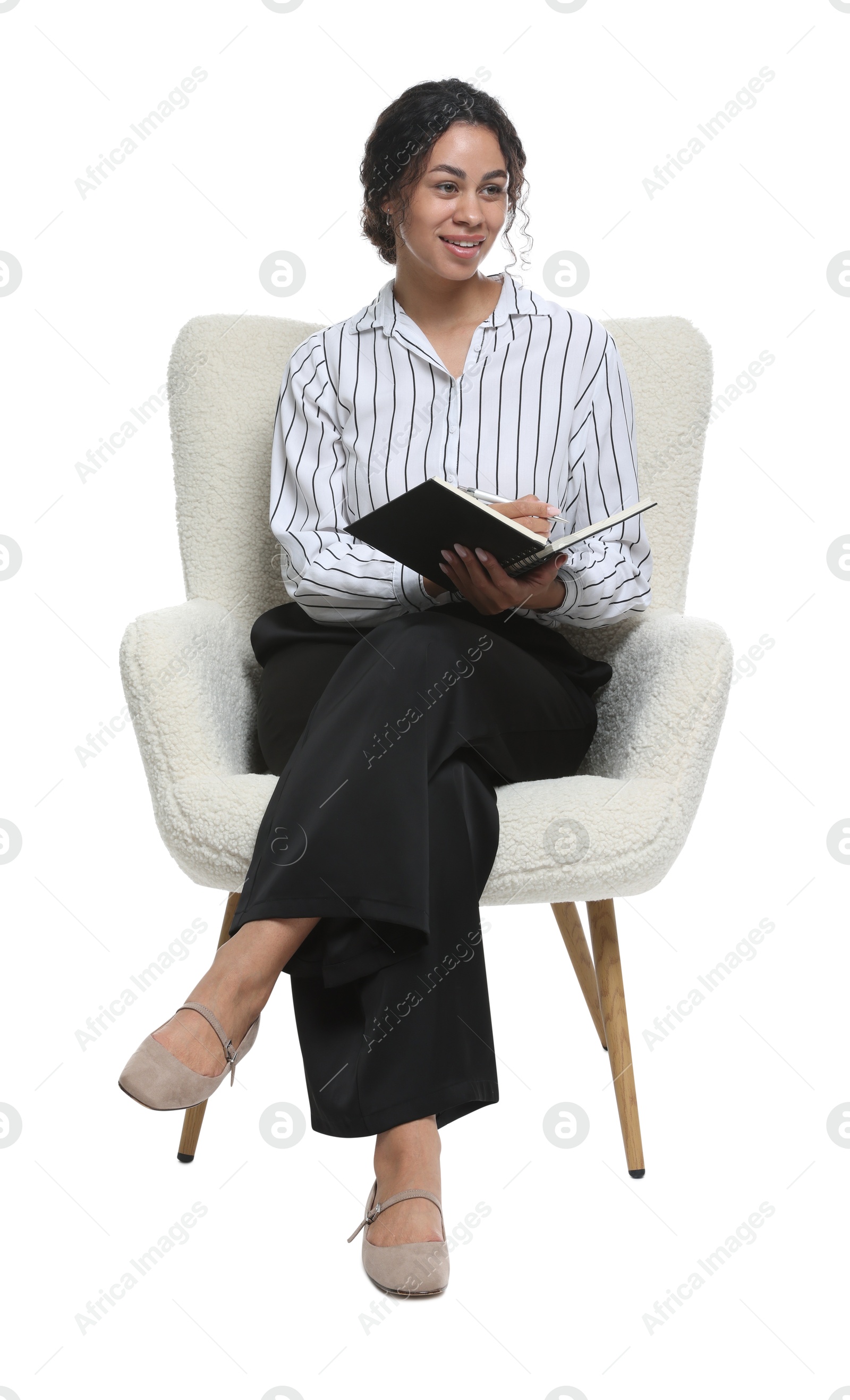Professional psychologist with notebook and pen in armchair on white background Photo of Professional psychologist with notebook and pen in armchair on white background
