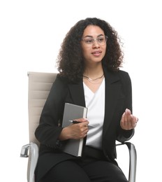 Photo of Professional psychologist with notebook and pen in office chair on white background
